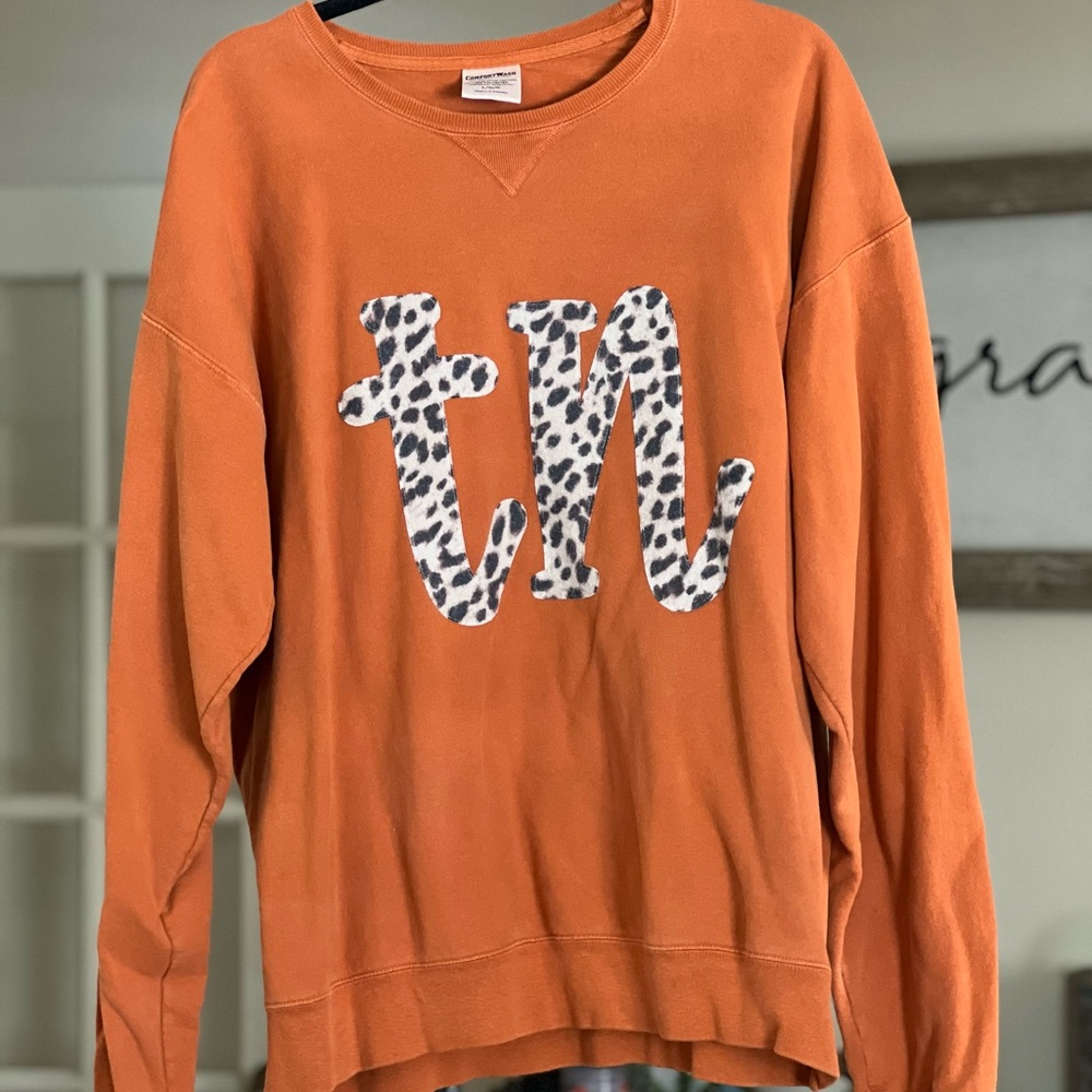 Stylish Orange Sweater with Leopard Print